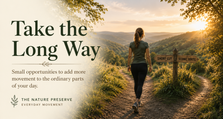 Woman walking along a scenic path at sunset beneath a signpost pointing toward the short cut and scenic route, for Take the Long Way.