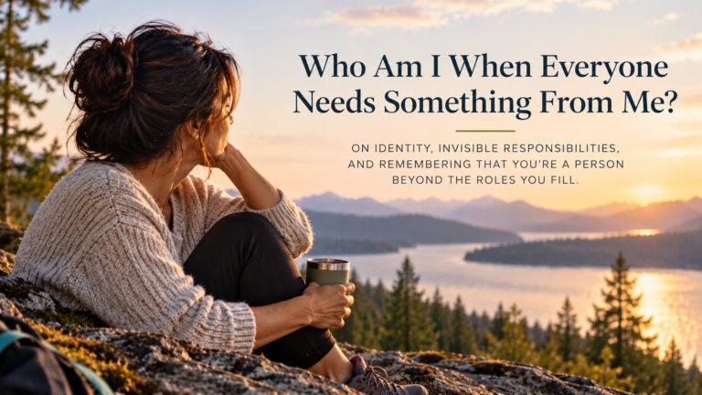 A dark-haired woman sits on a rocky overlook above a mountain lake at sunset, enjoying a quiet moment alone. The image includes the title “Who Am I When Everyone Needs Something From Me?” and its subtitle about identity and invisible responsibilities.